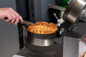 fresh waffles inside a waffle iron