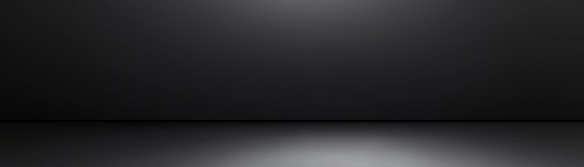 Fototapeta premium Empty dark studio background with soft lighting, perfect for showcasing products or creative projects.