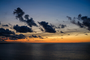 Romantic colorful sunset at the sea. View of Beautiful glorious golden sunset and golden hour above the sea in evening.