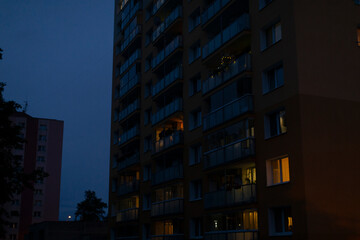 A very tall building, characterized by numerous windows, is beautifully illuminated during the...