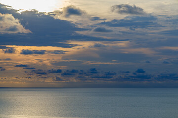 Romantic colorful sunset at the sea. View of Beautiful glorious golden sunset and golden hour above the sea in evening.