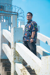 Hengsha Island, Shanghai - People standing by the railing under a blue sky
