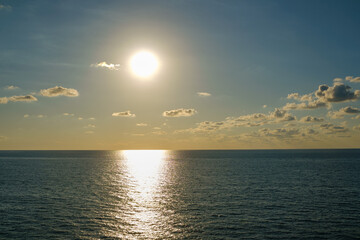 Romantic colorful sunset at the sea. View of Beautiful glorious golden sunset and golden hour above the sea in evening.