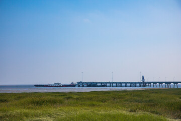 Fototapeta premium Hengsha Island, Shanghai - Seaside scenery against a blue sky