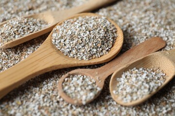 Different spoons with fresh rye bran, closeup