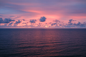 Romantic colorful sunset at the sea. View of Beautiful glorious golden sunset and golden hour above the sea in evening.
