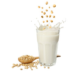 Soy beans falling into glass of plant milk on white background