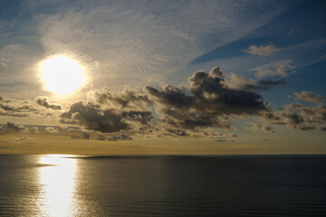 Romantic colorful sunset at the sea. View of Beautiful glorious golden sunset and golden hour above the sea in evening.