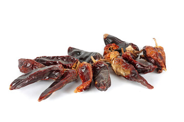 bunch of dried chillies peppers on a white background