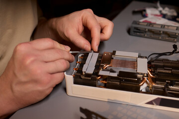 Hand Repairing a Graphics Card through the Application of Thermal Paste for Better Performance