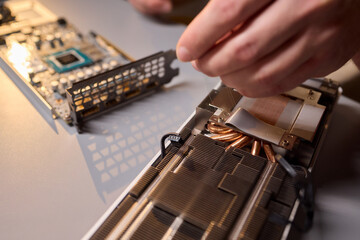 Hand Repairing a Graphics Card through the Application of Thermal Paste for Better Performance
