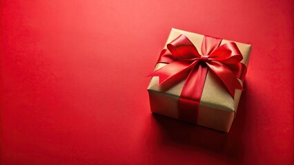 Obraz premium Christmas gift box on a red background with wide-angle view