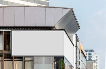 Mock up white corner LED display billboard on building. Clipping path for mockup