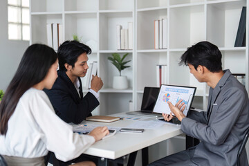 Business Team Collaborating in Modern Office, Exchanging Ideas and Discussing Work Strategies