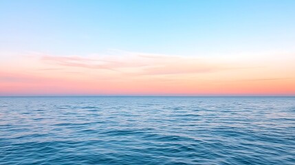 Fototapeta premium Stunning serene seascape at dawn with gentle waves and a colorful sky reflecting tranquility and beauty