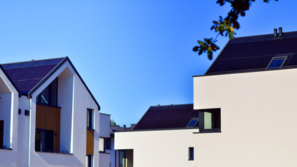 Residential homes with modern facade.Terraced family homes in newly developed housing estate. The real estate market in the suburbs. New single family houses in a new development area. 