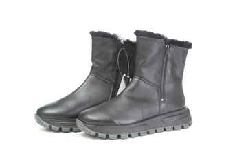 Pair of female winter boots close up on a white background