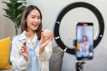 Influencer live internet, happy vlog asian young woman blogger using smart phone talking on video...