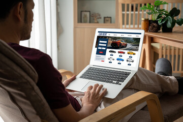 car rental website on computer screen for tourist to rent a car for transportation snugly