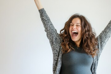 A woman with her arms raised in celebration or worship