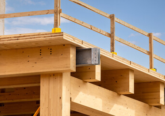 Detail of a glue laminated floor panel on mass timber beams and posts in a multi story green,...