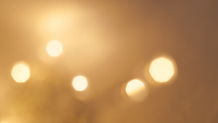 Bright golden bokeh lights create a vibrant and festive holiday background