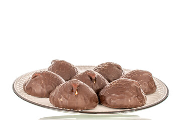 Marshmallow in chocolate on ceramic dish, macro, isolated on white background.