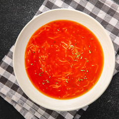 Tomato soup with vermicelli dish fresh gourmet food background on the table rustic food top view copy space
