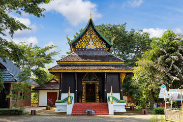 Fototapeta premium Nan, Thailand - September 27, 2022 : Old Wiharn of Tai Lue Style at Wat Rong Ngae has been registered by Nan Provincial Cultural Council as one of the oldest image halls at Pua, Northern of Thailand