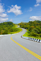 Popular view point of double s-curve road up to the hill with green tree and sky, called curve number 3 at Nan province, Northern of Thailand