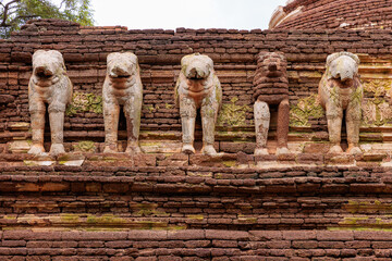 Close up of elephant wall at Wat Chang Rob temple in Kamphaeng Phet Historical Park, UNESCO World Heritage site, popular destination of tourist in Kamphaeng province, Northern of Thailand