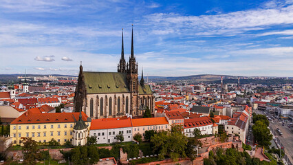 Brno, Czech Republic. Cinematic Aerial view to the Roman Catholic cathedral. Originally medieval in gothic style, many renovations, High towers added in Gothic revival between 1901-1909. Aerial view. 