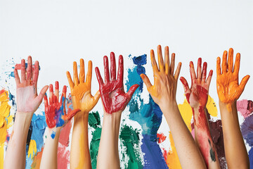 A vibrant composition featuring multiple hands covered in colorful paint raised against a white background with abstract brush strokes