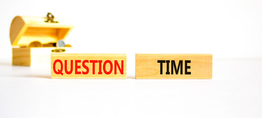 Question time symbol. Concept words Question time on beautiful wooden blocks. Beautiful white background. Wooden chest with coins. Business and question time concept. Copy space.