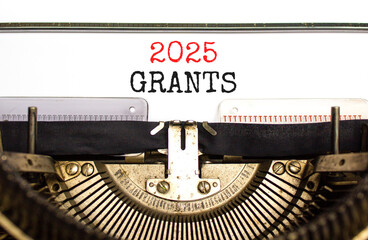 Planning 2025 grants new year symbol. Concept words 2025 Grants typed on beautiful old retro vintage typewriter. Beautiful white paper background. Business 2025 grants new year concept. Copy space.