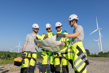 Fototapeta premium Engineers are having a discussion at wind turbine field