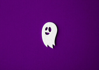 Handcrafted Felt Halloween Decorations on Dark Violet Background – Spooky Felt Ghost for DIY Craft Projects, Seasonal Party Decorations, and Festive Home Decor