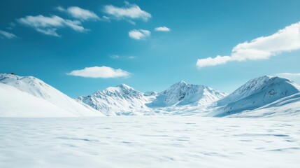 A stunning winter landscape featuring snow-covered mountains under a clear blue sky.