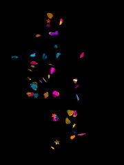 round multicolored confetti made of paper and foil isolated on a black and white background