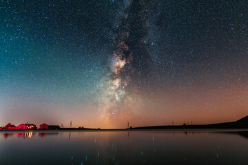 Beautiful night landscape, Bright Milky Way galaxy over the small  lake, starry sky. 