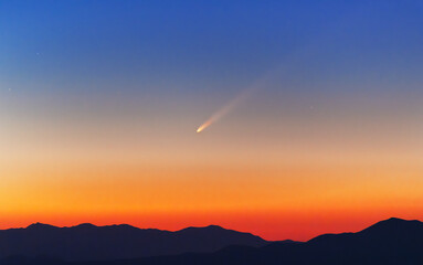 Beautiful bright sunrise in the mountains with Comet C/2023 /A3 Tsuchinshan-Atlas at the  sky.