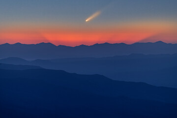 Beautiful bright sunrise in the mountains with Comet C/2023 /A3 Tsuchinshan-Atlas at the  sky.