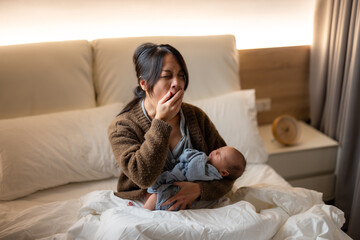 Asian mum take care of the new born baby overnight at home