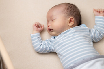 Adorable newborn baby sleep on bed