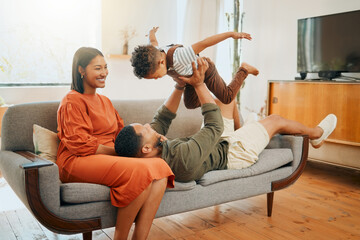 Funny, airplane and bonding with family on sofa for love, playful game and happiness together....