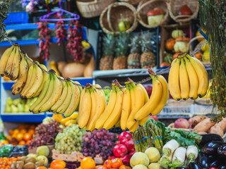 Market stall with fresh colorful fruits and vegetables