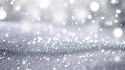 Obraz premium A shimmering, snow-like background with soft bokeh lights, evoking a wintery ambiance.