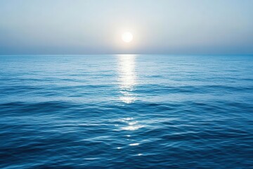 Fototapeta premium Gentle moonlight touching the surface of calm ocean waves, creating a dreamlike glow across the water