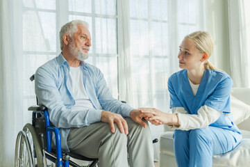 Fototapeta premium Help support retirement healthcare. Nurse helping old man in wheelchair. Patient and woman in nursing home for medical caregiver. Nurse taking care of paralyzed man in chair for people with disability