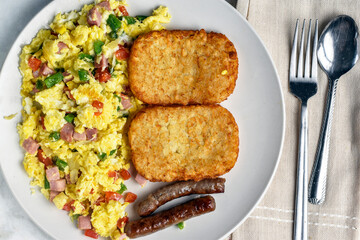  scramble eggs with hash browns and  sausages